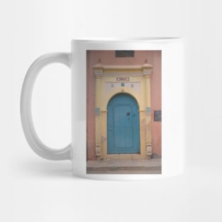 Blue Moroccan door with pink wall Mug